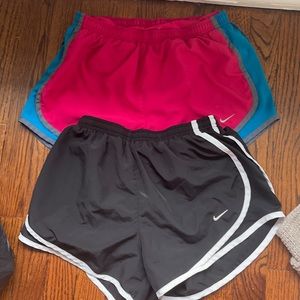 4 pairs of nike running shorts